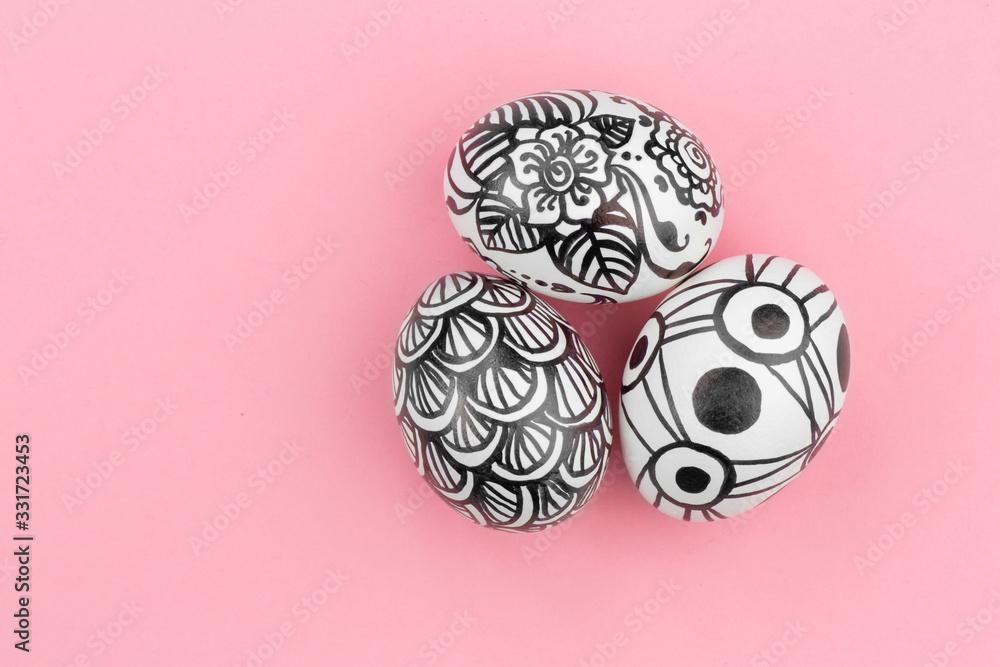 Easter eggs are painted black and white, abstraction, are nearby. Easter eggs are painted black and white, abstraction, are nearby.