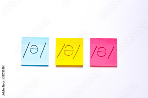 Three post its on white background with a different symbols