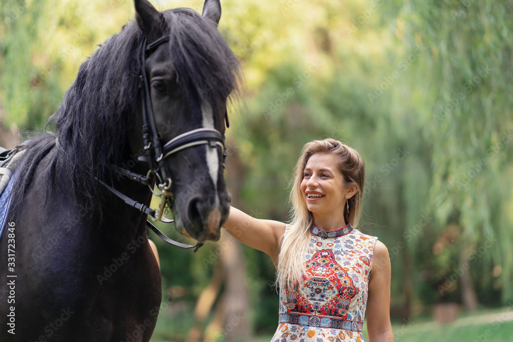 Obraz premium Young woman with a horse