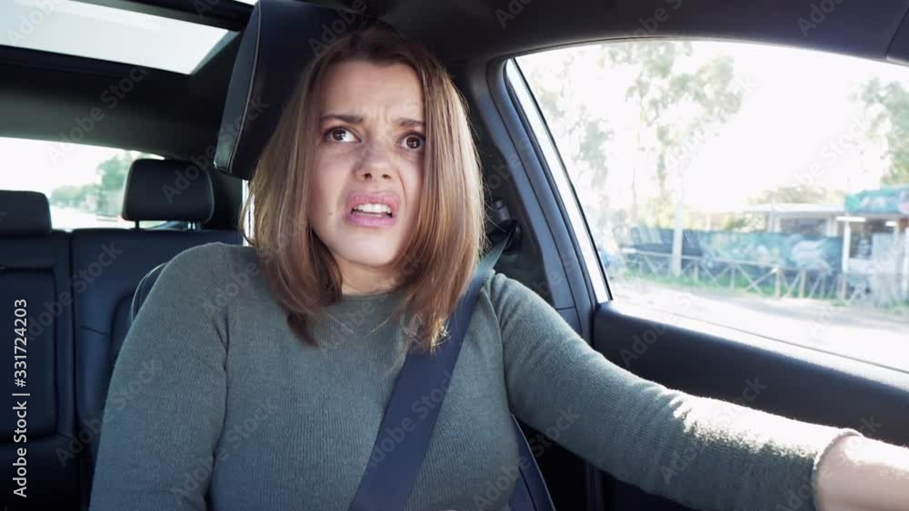 Woman in traffic getting angry while driving car