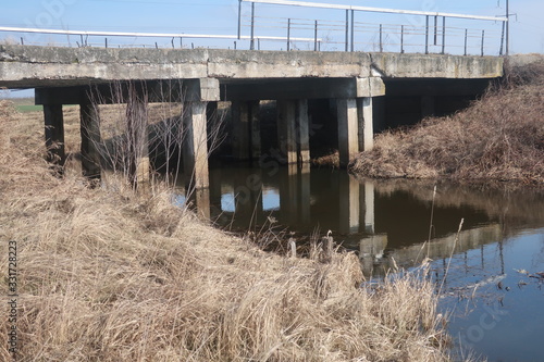  bridge over a small river against a blue sky