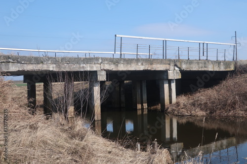  bridge over a small river against a blue sky
