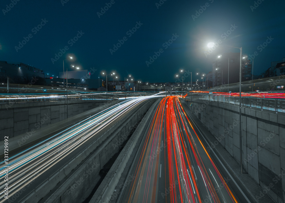 Red and White light trails of cars on a freeway