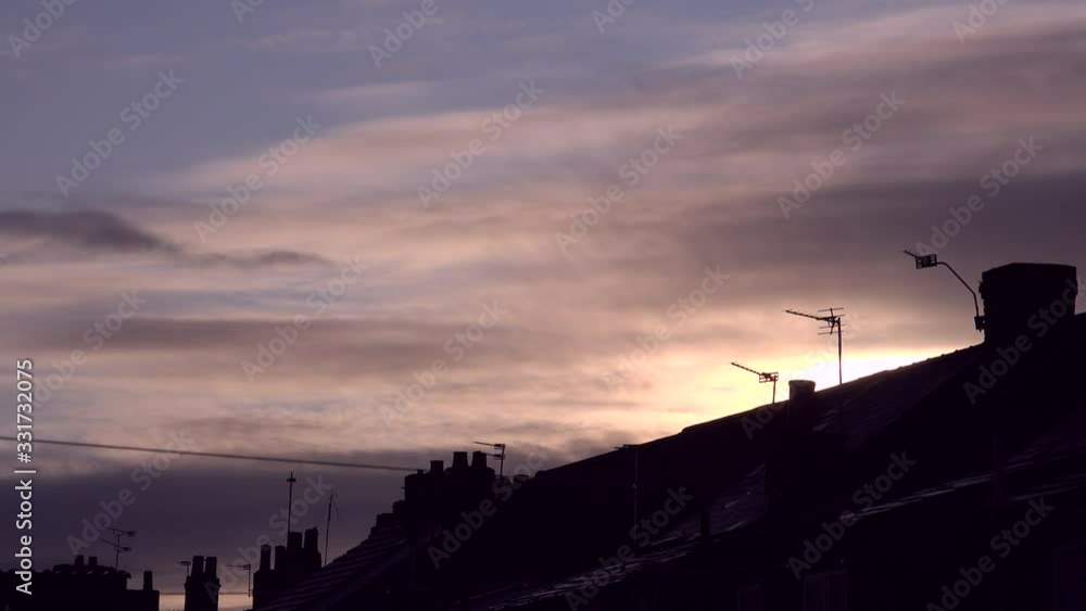 Sunset in the night sky over terrace housing UK 4K Sunset in the night sky over terrace housing UK 4K