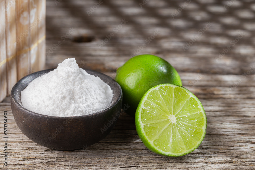 Baking soda and lemon on wooden background space for text Baking soda and lemon on wooden background space for text