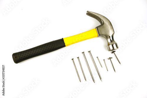 Hammer and nails of various sizes Isolated on white background.