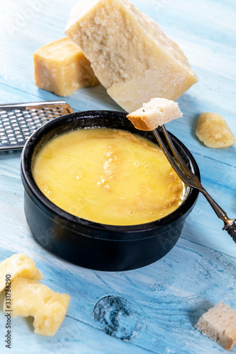 Swiss fondue melted cheese served with bread