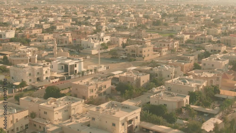 Low altitude aerial view of residential houses and streets in Dubai, United Arab Emirates UAE