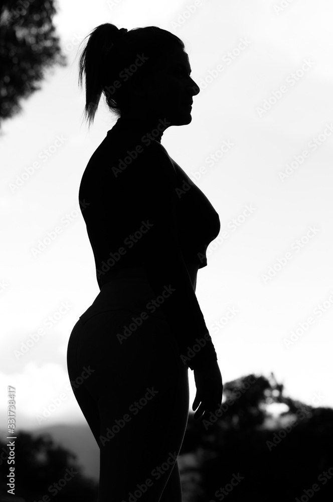 silhouette of woman portrait in the middle of nature