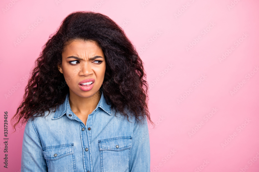 Close up photo of frustrated upset afro american girl look copyspace dislike smell grimace wear casual style outfit isolated over pink color background Close up photo of frustrated upset afro american girl look copyspace dislike smell grimace wear casual style outfit isolated over pink color background