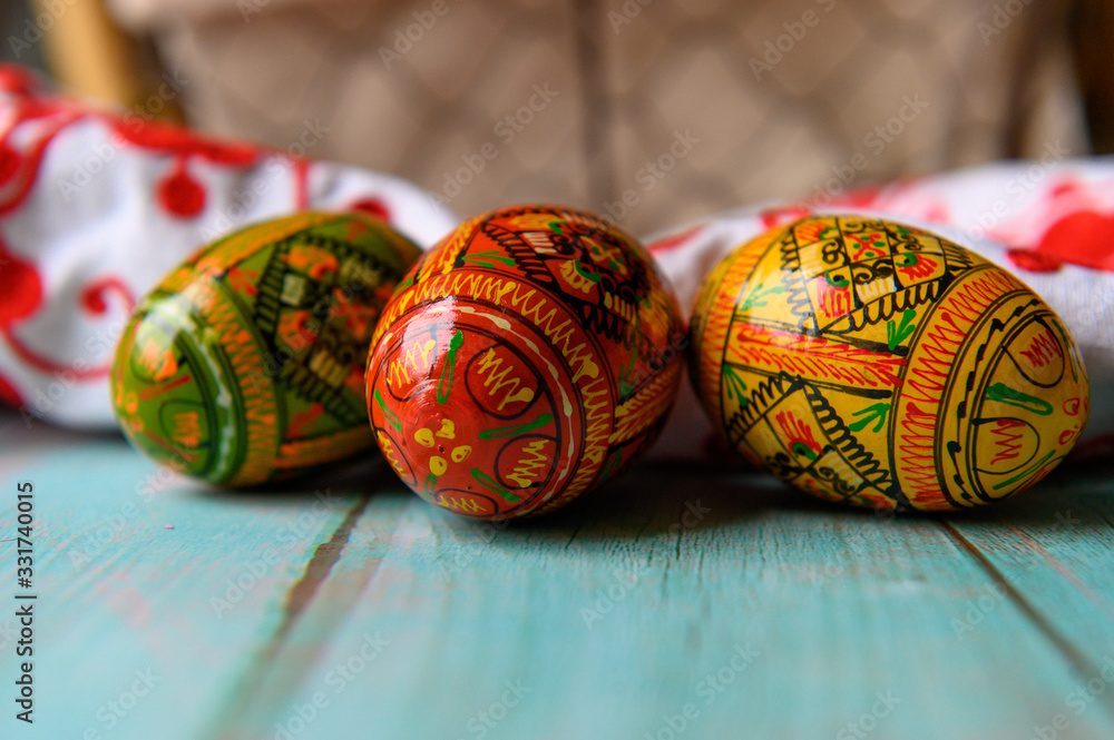 Colorful easter eggs on wooden background.