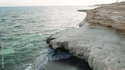 Waves break on the rocky shore