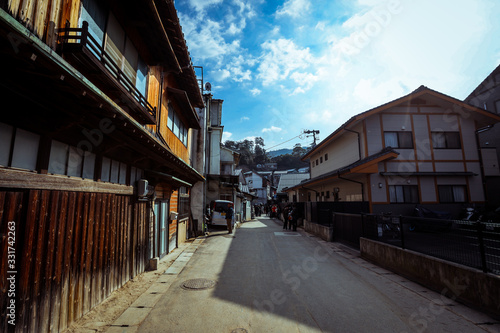 Miyajima, Japan - January 02, 2020: Cityscape to the Walking Tourists and Itsukushima streets