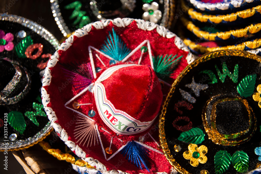 Mexican sombreros are wide brim hats sold at market in Mexico Mexican sombreros are wide brim hats sold at market in Mexico