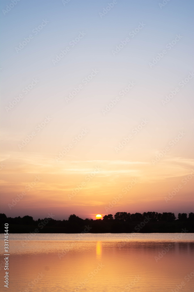 Fototapeta premium sunset over lake