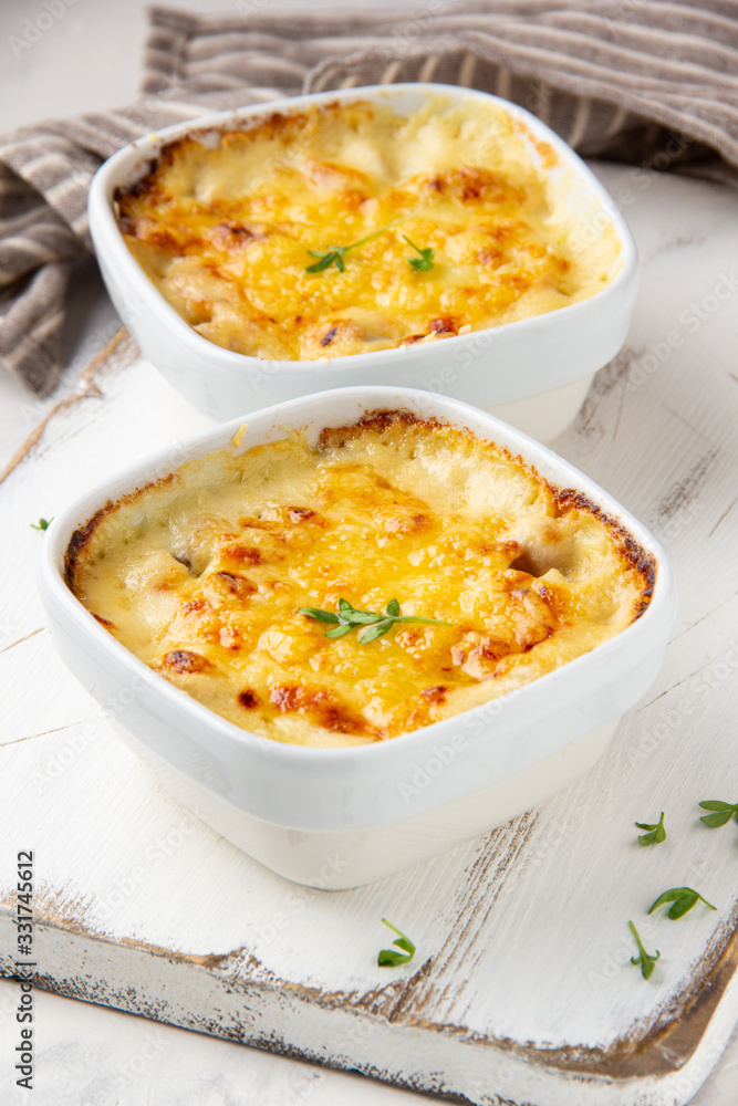 Casserole with a golden crust , mushroom julienne with baked cheese, creamy gratin.