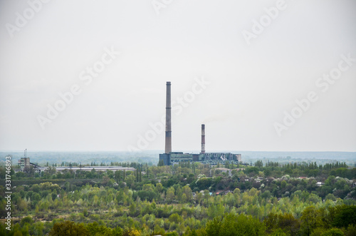 Wallpaper Mural Smoke pipes of the functioning heat and power station in Chernihiv. Ukraine. Smoke from pipes is released into the air. Industrial landscape Torontodigital.ca
