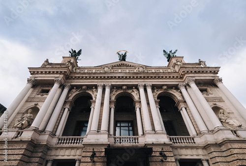 Facade of Lviv theatre of opera and ballet. The central sculpture on roof is Glory, left one is Music, right figure is Comedy and Drama. Copy space.