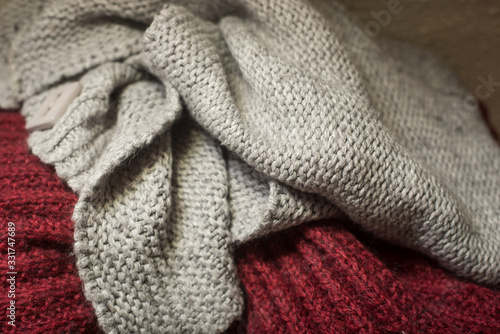 Closeup of woolen pullover stacked at home