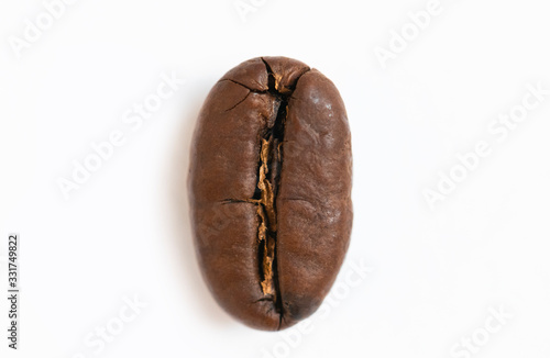 Close-up coffee bean on the white background. Macro photography.