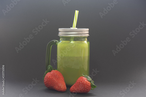 Strawberry smoothie with a black background. Strawberry smoothie is a very healthy drink.