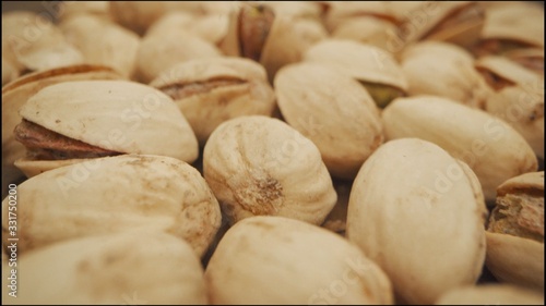 extreme close-up of pistachio, isometric view. Close-up of pistachios. Macro video shooting of nuts, pistachios.