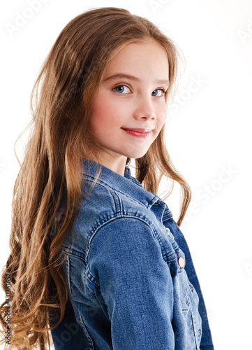 Portrait of adorable smiling little girl child isolated on a white