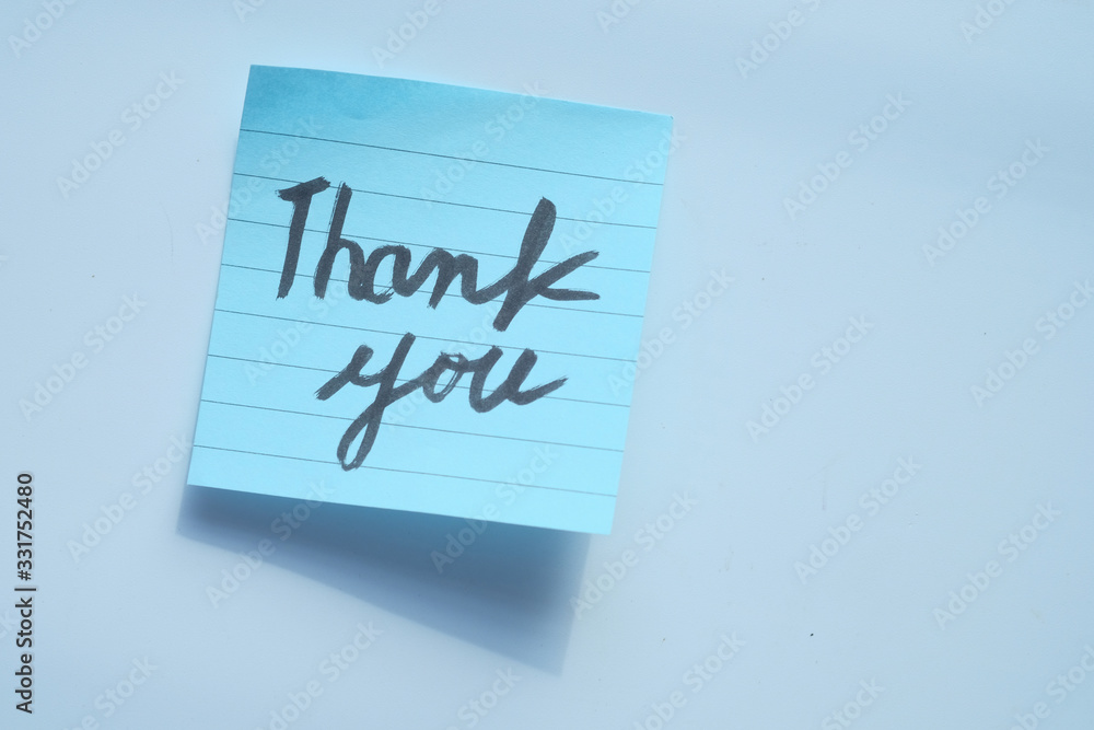 top view of thank you message on white background top view of thank you message on white background
