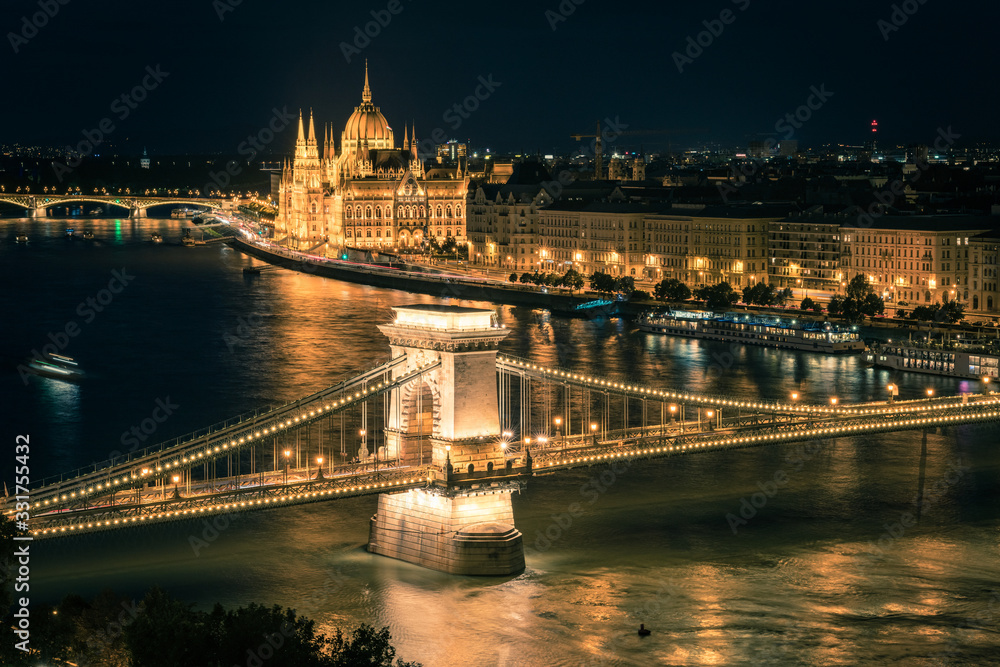 Budapest panorama at sunset. Landmarks: The Parliament, the chain bridge and the Danube river, Hungary