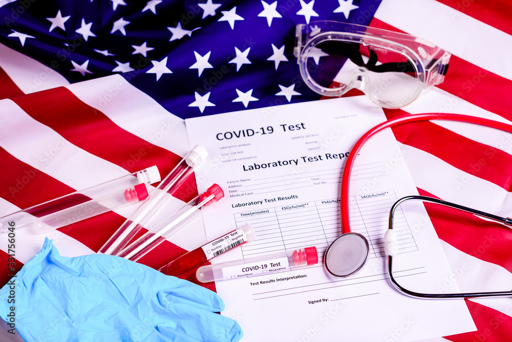 Naklejka premium Test tubes and protection material to perform a covid-19 test against the virus epidemic in the United States of America.