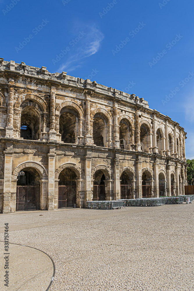 Ancient Nimes Roman Amphitheatre. Nimes Arena (70 CE) - one of the best-preserved amphitheaters in the world. Nimes, Occitanie region of southern France.