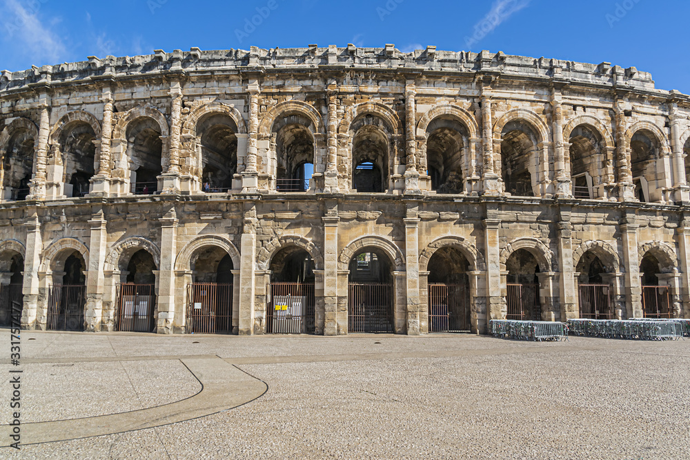 Ancient Nimes Roman Amphitheatre. Nimes Arena (70 CE) - one of the best-preserved amphitheaters in the world. Nimes, Occitanie region of southern France.
