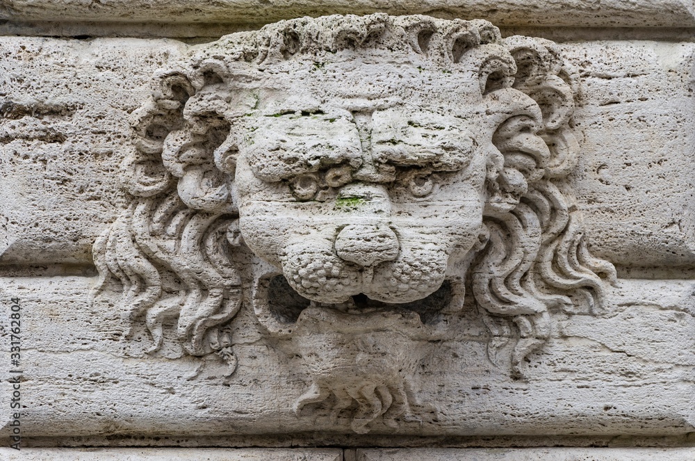 Characteristic stone lion head in montepulciano