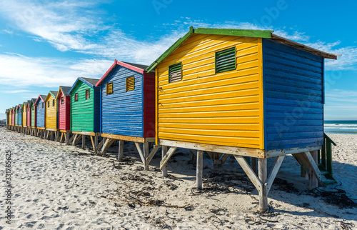 Colorful wooden beach huts on Muizenberg beach near Cape Town, a famous place for surfing, South Africa. © SL-Photography