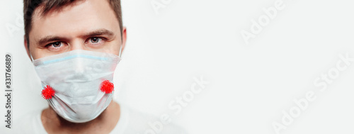 a man in a medical mask adhering to attacking viruses. quarantine coronavirus covid 19 pandemic panic fear danger health protection concept 19 on white background isolation