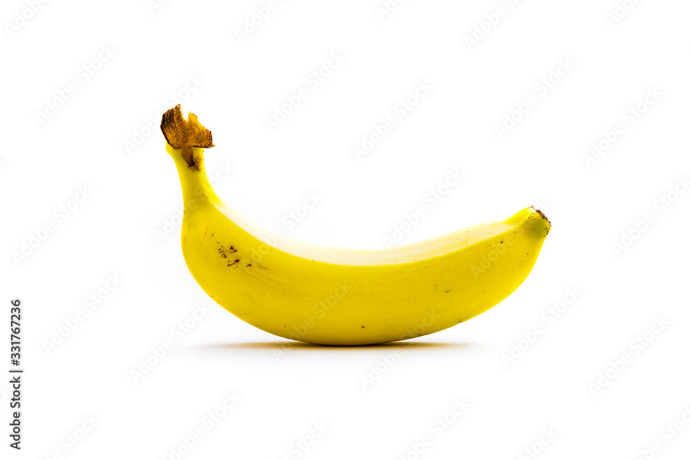 a bright yellow ripe banana isolated from a white background and copy space a bright yellow ripe banana isolated from a white background and copy space