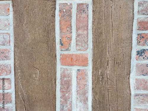 Background texture half timbered house and a brick red wall photo