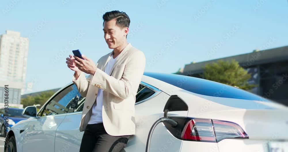 man Charges electric car man Charges electric car