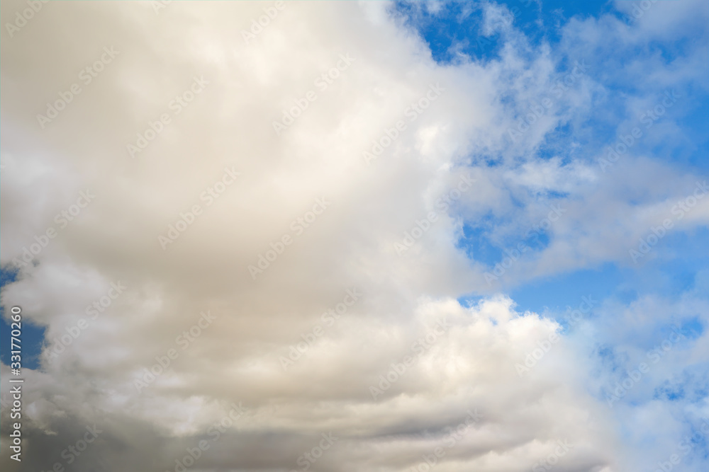 Fototapeta premium Blue summer sky with white cumulus clouds. Blue sky with clouds nature background.