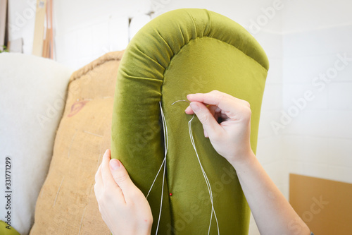 Принти на полотні Making new upholstery on old armchair