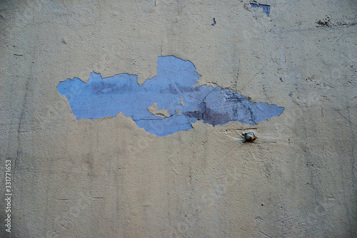 The concrete texture, wall, with cracks and scratches can be used as a background
