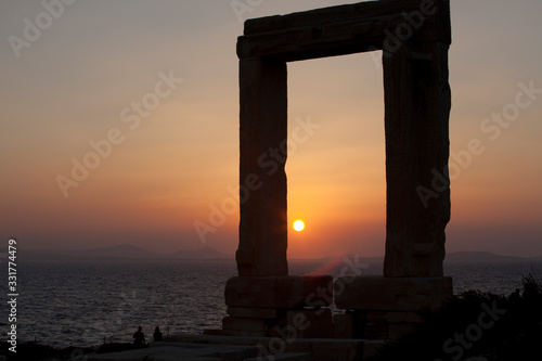 Naxos Town, Naxos / Greece - August 25, 2014: Gate of the temple of Apollo, Portara, Naxos Town, Naxos, Cyclades Islands, Greece