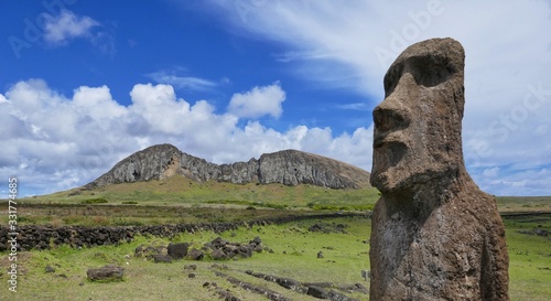 Easter Island – Moai stone statue with a view to Ranu Raraku vulcano
