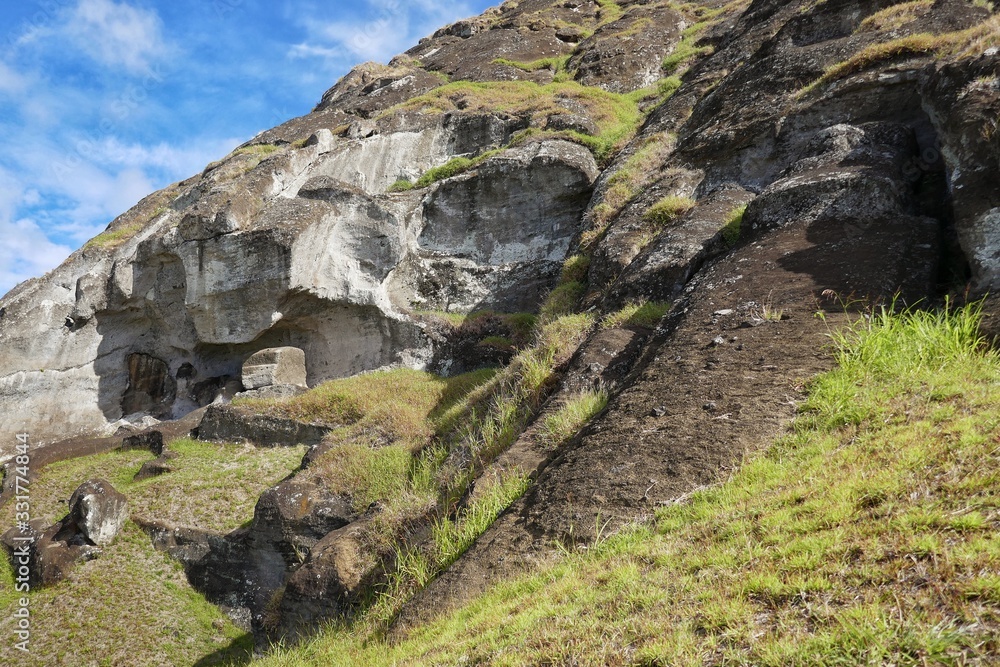 Easter Island – Unfinished Moai stone statue at the Ranu Raraku vulcano stone quarry Easter Island – Unfinished Moai stone statue at the Ranu Raraku vulcano stone quarry