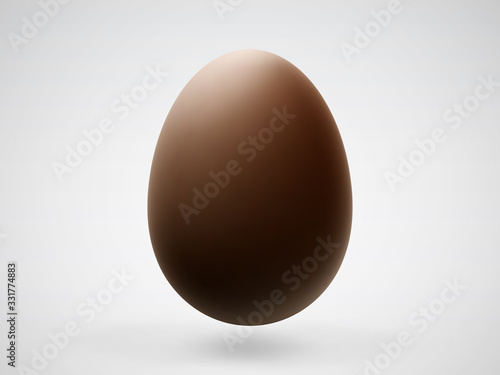 Single realistic chocolate Easter 3D egg with shadow on white background. Vector illustration of brown sweet chocolate chicken egg - traditional symbol of Easter holiday celebration.