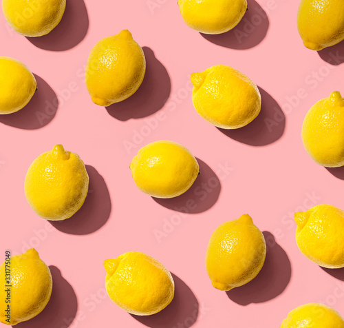 Obraz na plátně Fresh yellow lemons overhead view - flat lay