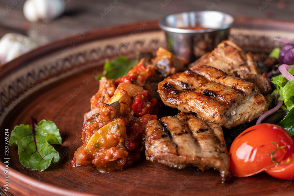 Turkey skewers, vegetable salsa and barbecue sauce, restaurant dish, Closeup, Horizontal orientation