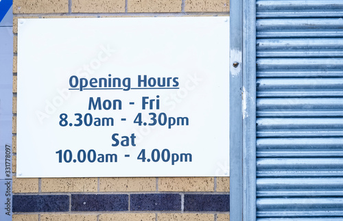 Opening hours of business sign Monday to Friday and Saturday