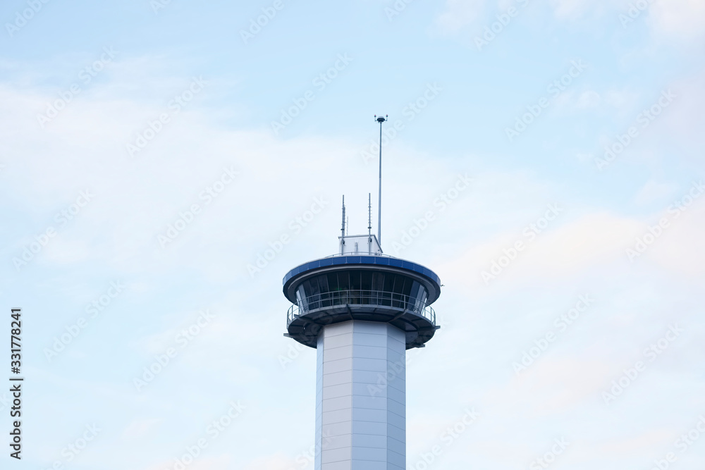 Communication tower high in blue sky with aerial for mobile technology network Communication tower high in blue sky with aerial for mobile technology network