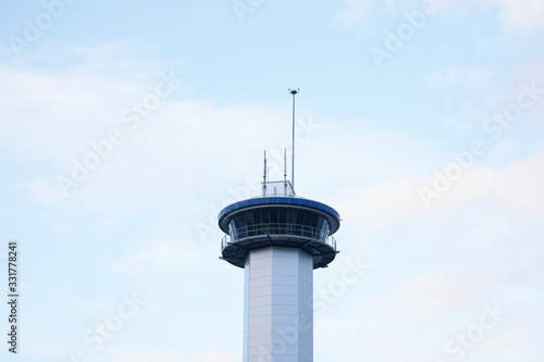 Communication tower high in blue sky with aerial for mobile technology network